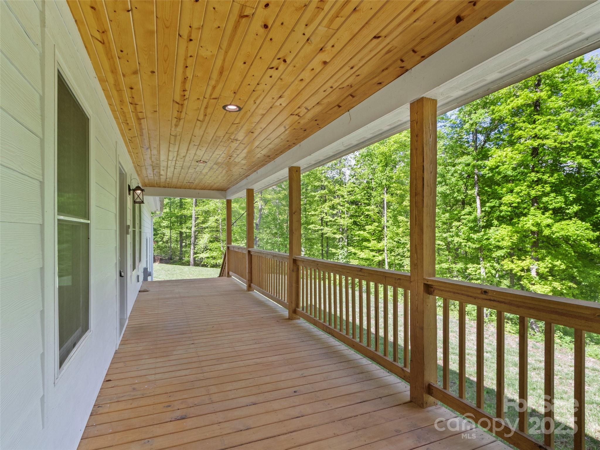 155 Pebble Ridge Road Spruce Pine, NC 28777 - Photo 32 of 39 a view of a porch with wooden floor and outdoor space