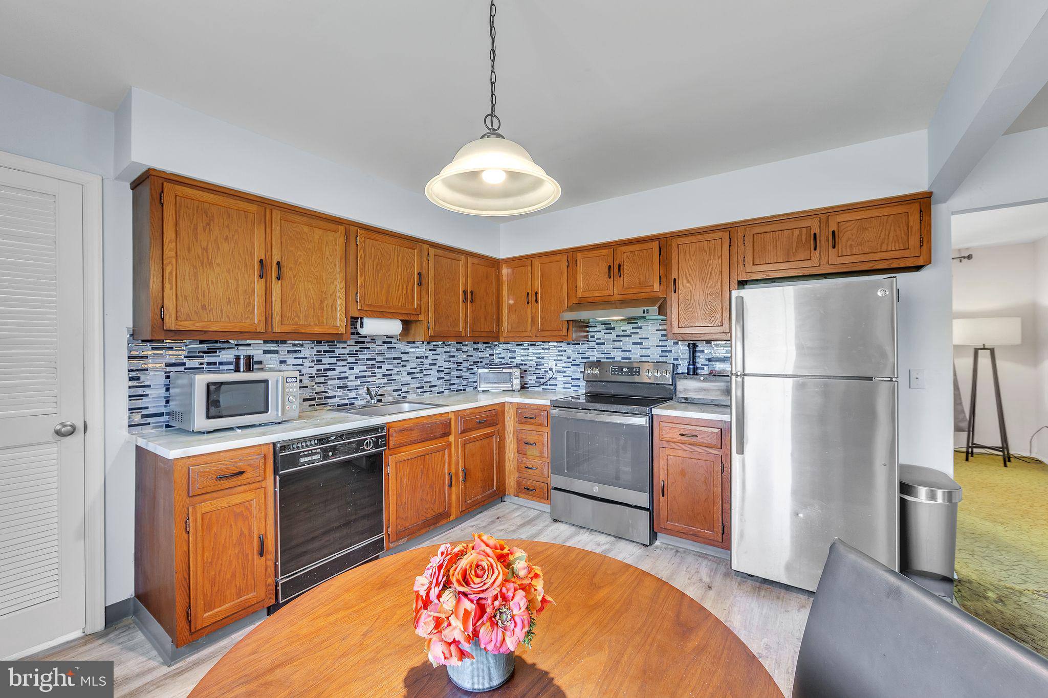 150 Red Stone Ridge Delran, NJ 08075 - Photo 16 of 28 a kitchen with stainless steel appliances granite countertop a refrigerator a stove top oven a sink and dishwasher