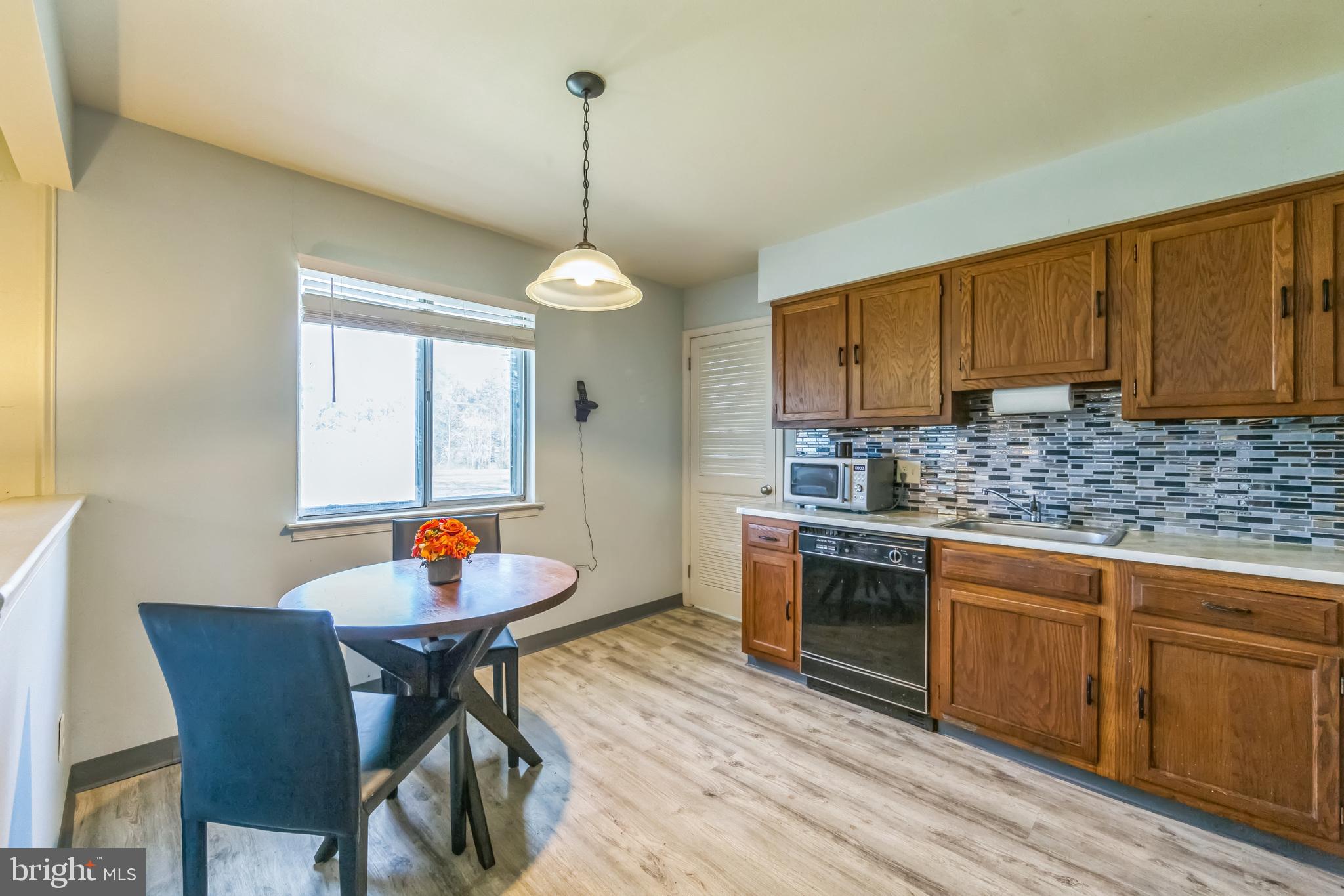 150 Red Stone Ridge Delran, NJ 08075 - Photo 17 of 28 a kitchen with a sink cabinets and window