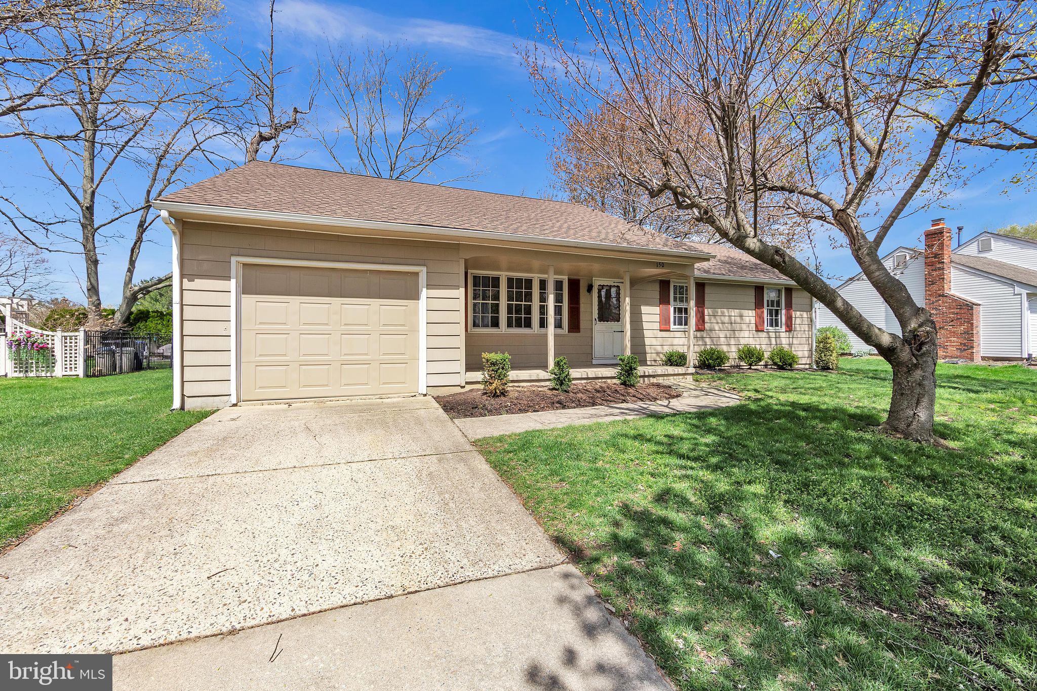 150 Red Stone Ridge Delran, NJ 08075 - Photo 3 of 28 a front view of a house with yard patio and green space