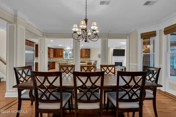 a living room with furniture a rug and a flat screen tv