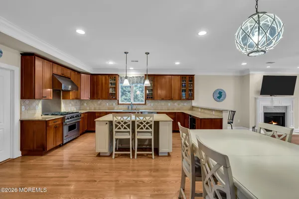 a bedroom with a bed a flat screen tv and a large window