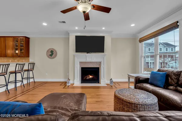 a bedroom with a bed couch and a window