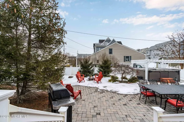 a bathroom with a tub a sink and a mirror