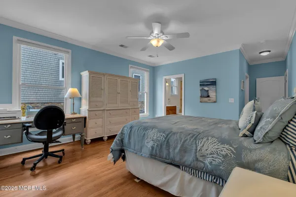 a dining room with furniture and a floor to ceiling window
