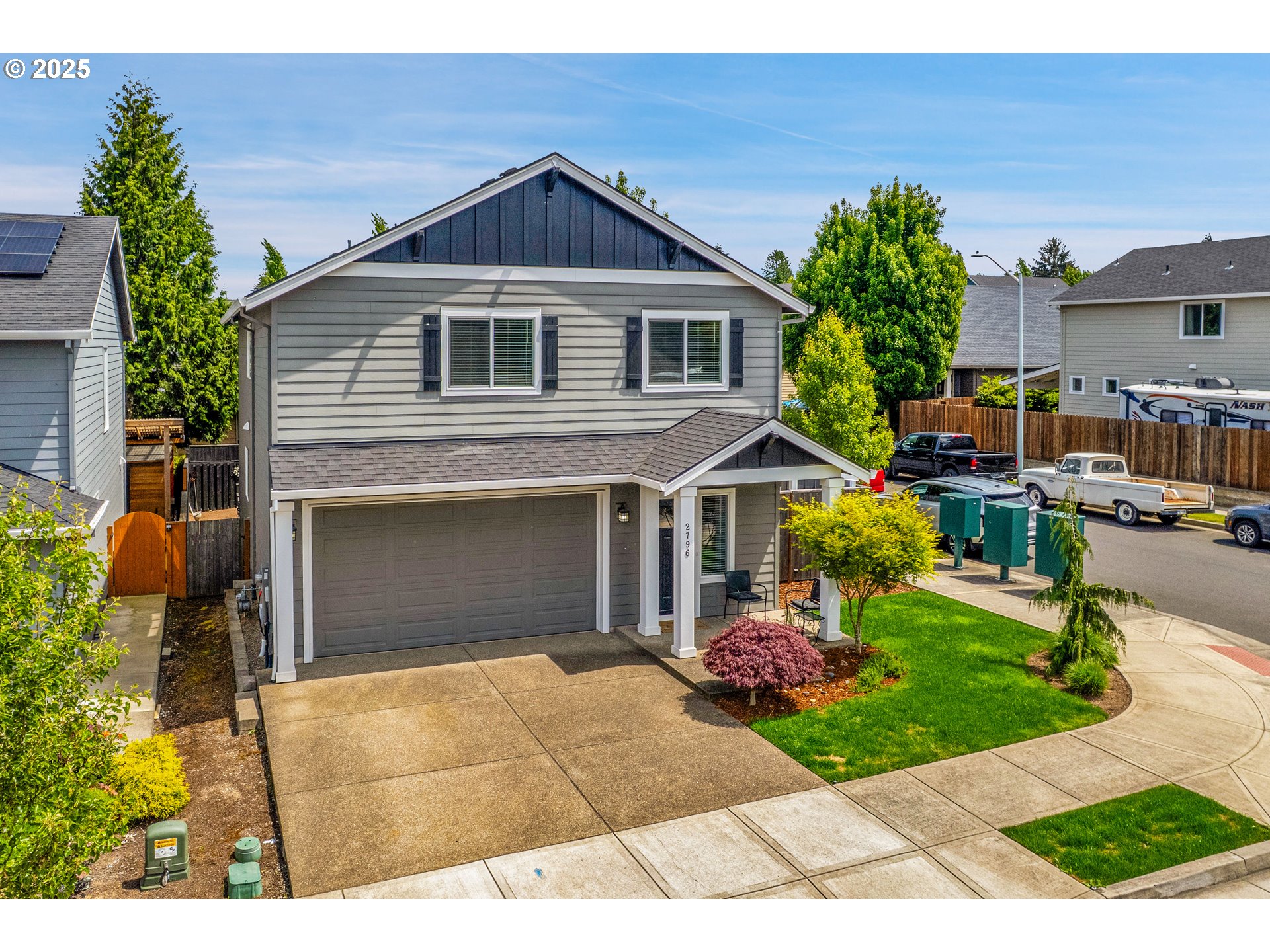 a front view of a house with garden
