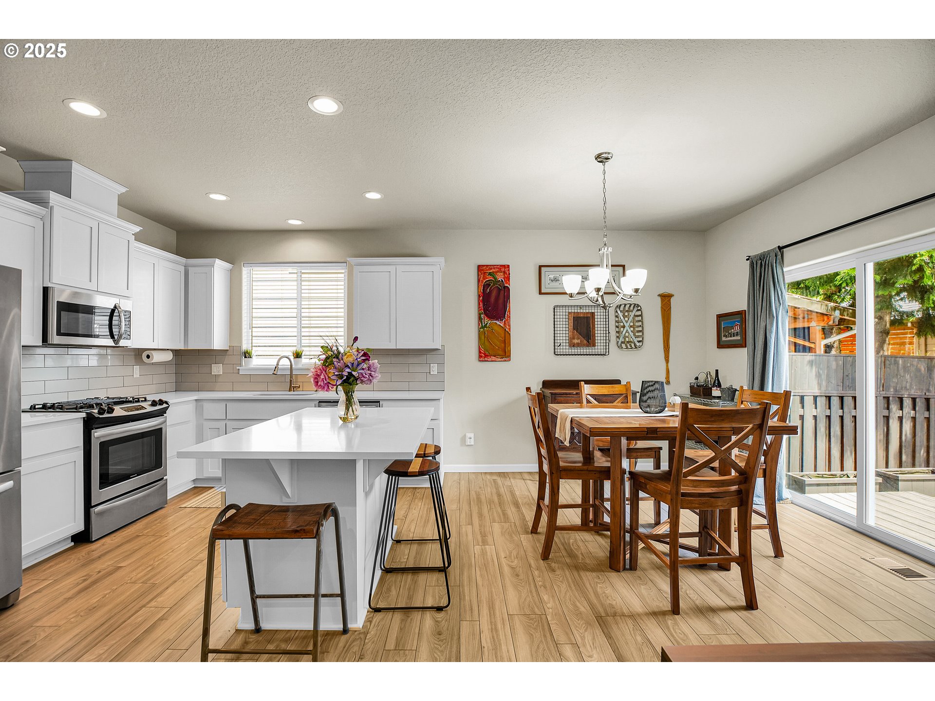 2796 Southeast Baker Avenue Gresham, OR 97080 - Photo 14 of 48 a view of dining table chairs and wooden floor