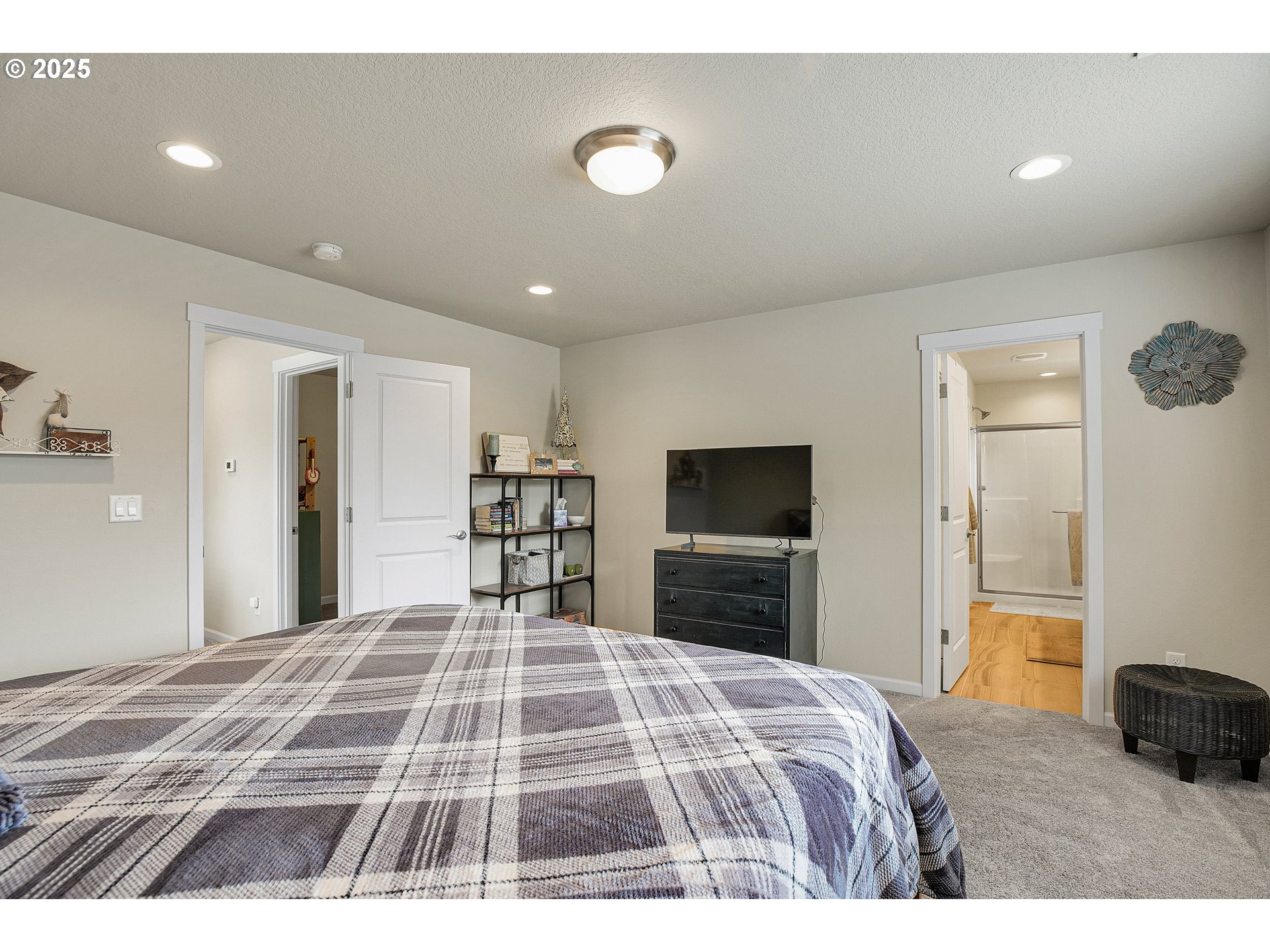 2796 Southeast Baker Avenue Gresham, OR 97080 - Photo 20 of 48 a bedroom with a bed and a flat screen tv
