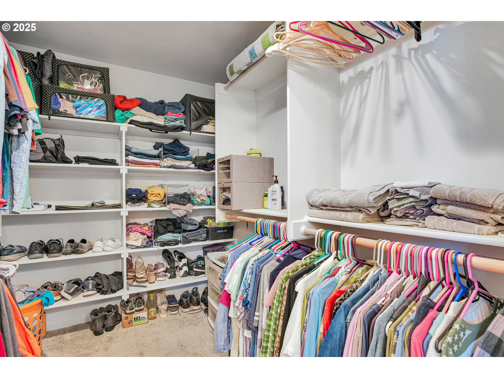 2796 Southeast Baker Avenue Gresham, OR 97080 - Photo 23 of 48 a view of walk in closet with clothes and shoes