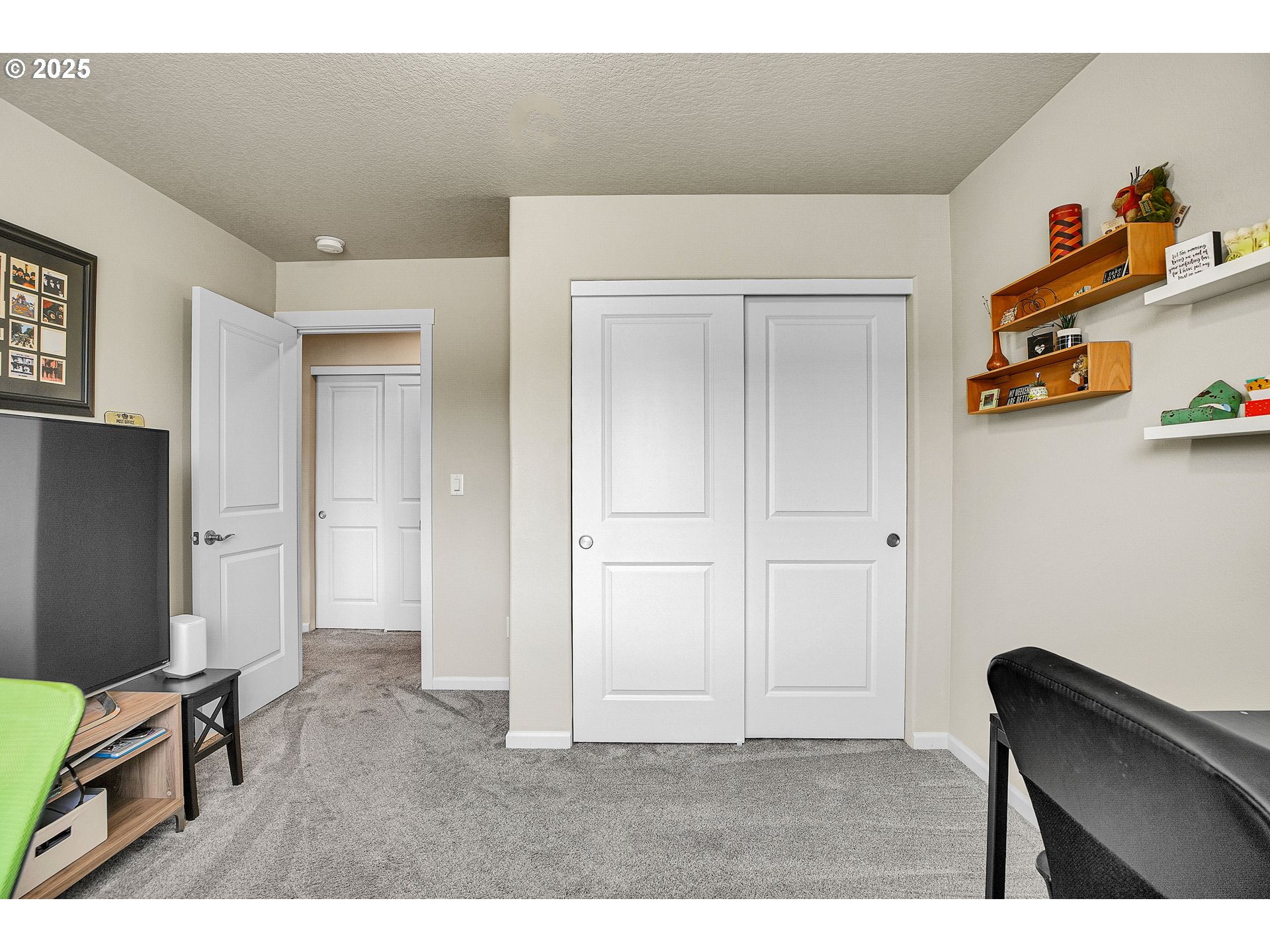 2796 Southeast Baker Avenue Gresham, OR 97080 - Photo 28 of 48 a living room with furniture and a flat screen tv