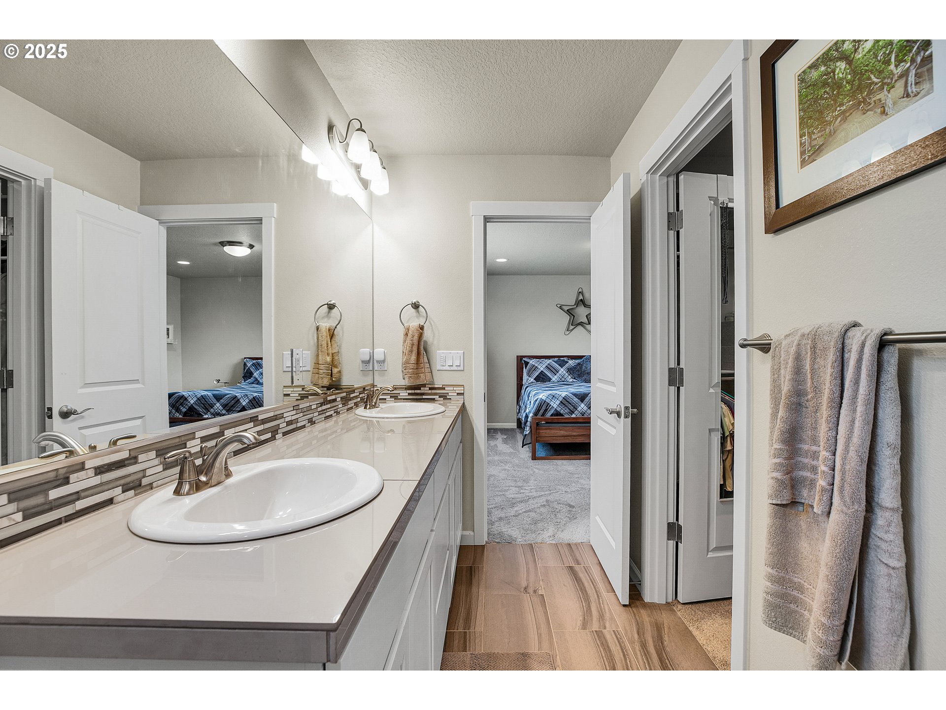 2796 Southeast Baker Avenue Gresham, OR 97080 - Photo 30 of 48 a en suite bathroom with a sink and a mirror