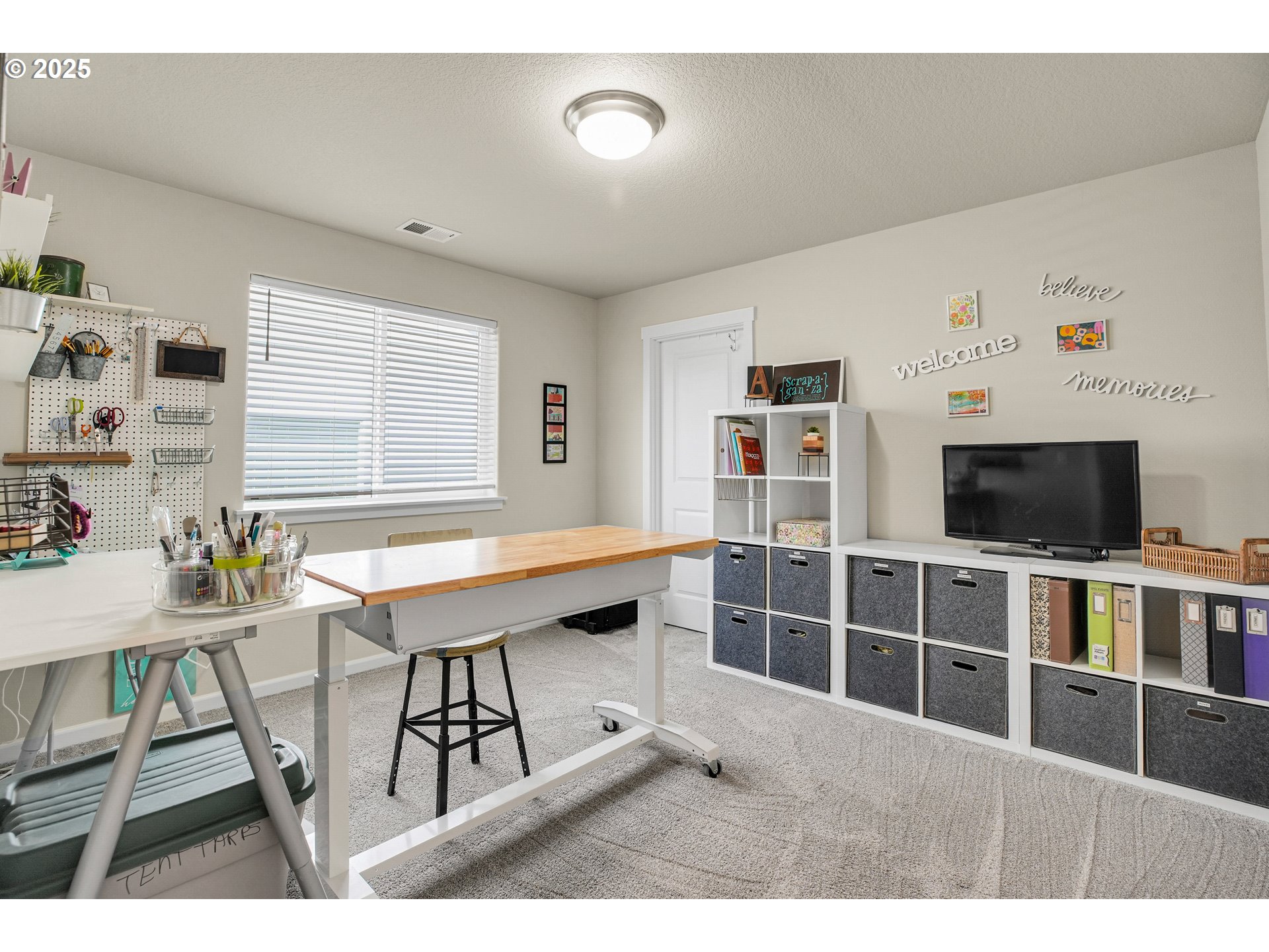 2796 Southeast Baker Avenue Gresham, OR 97080 - Photo 36 of 48 a living room with furniture a flat screen tv and a table