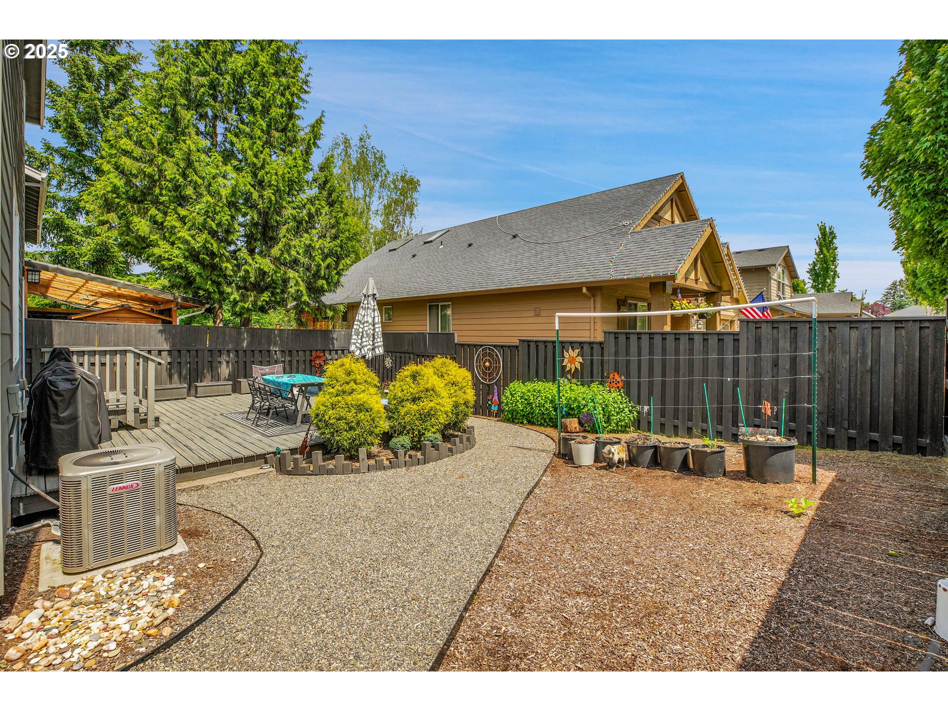 2796 Southeast Baker Avenue Gresham, OR 97080 - Photo 41 of 48 a view of a patio with table and chairs and potted plants