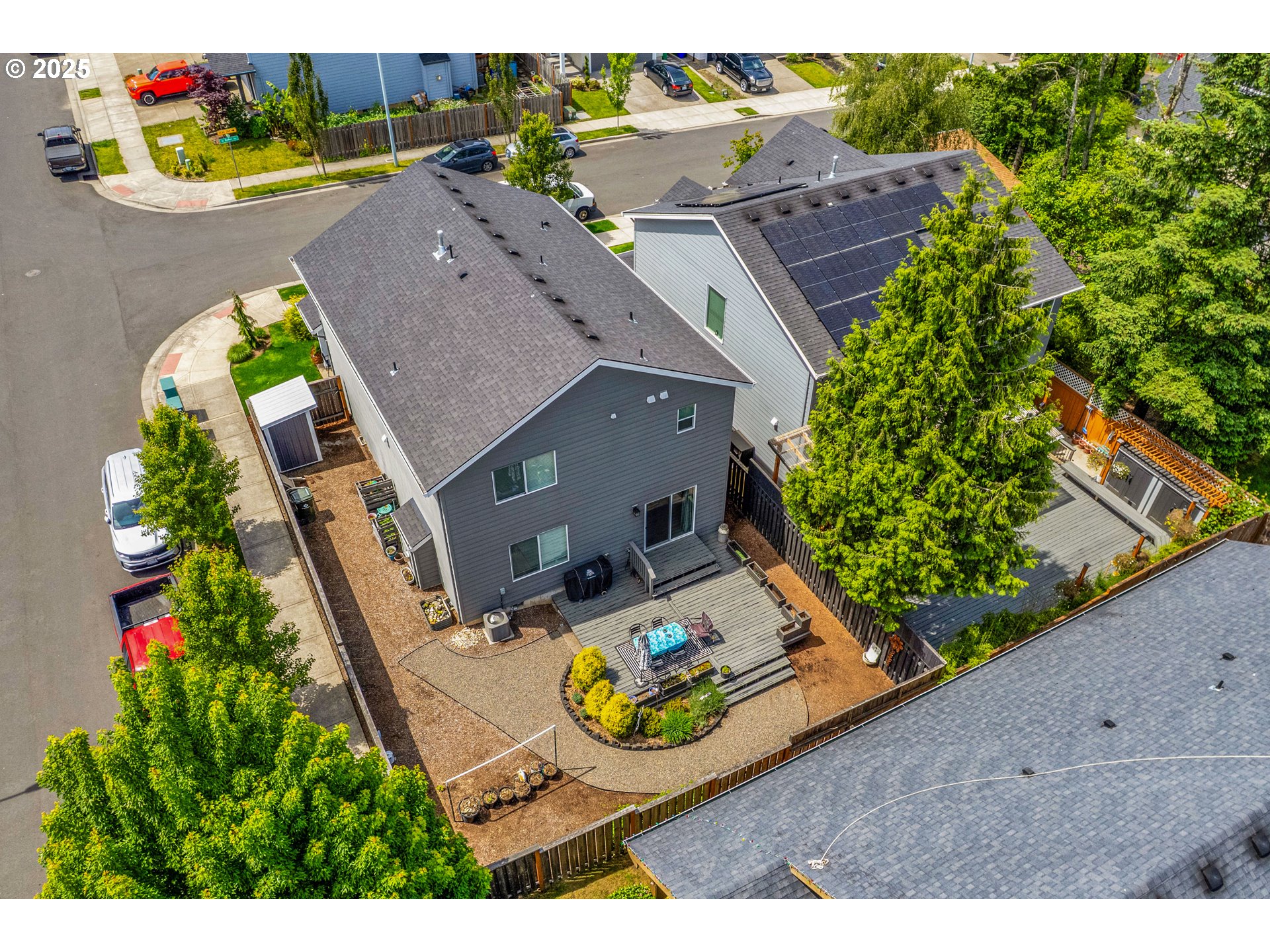2796 Southeast Baker Avenue Gresham, OR 97080 - Photo 44 of 48 an aerial view of a house with a garden and trees