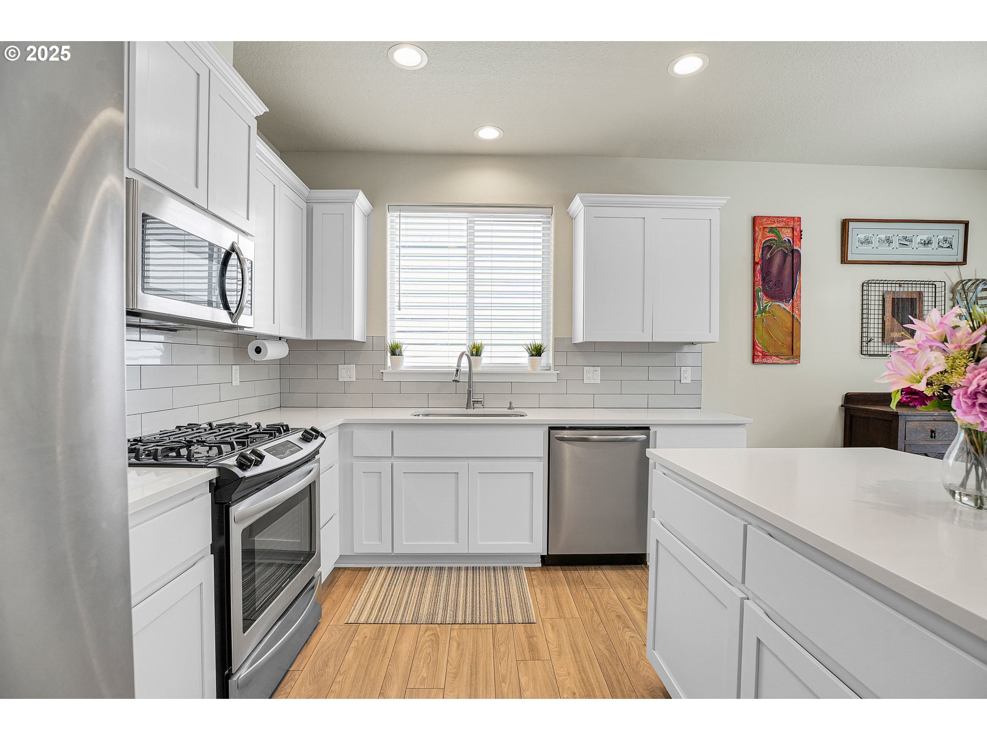 2796 Southeast Baker Avenue Gresham, OR 97080 - Photo 8 of 48 a kitchen with stainless steel appliances granite countertop a stove a sink and a microwave