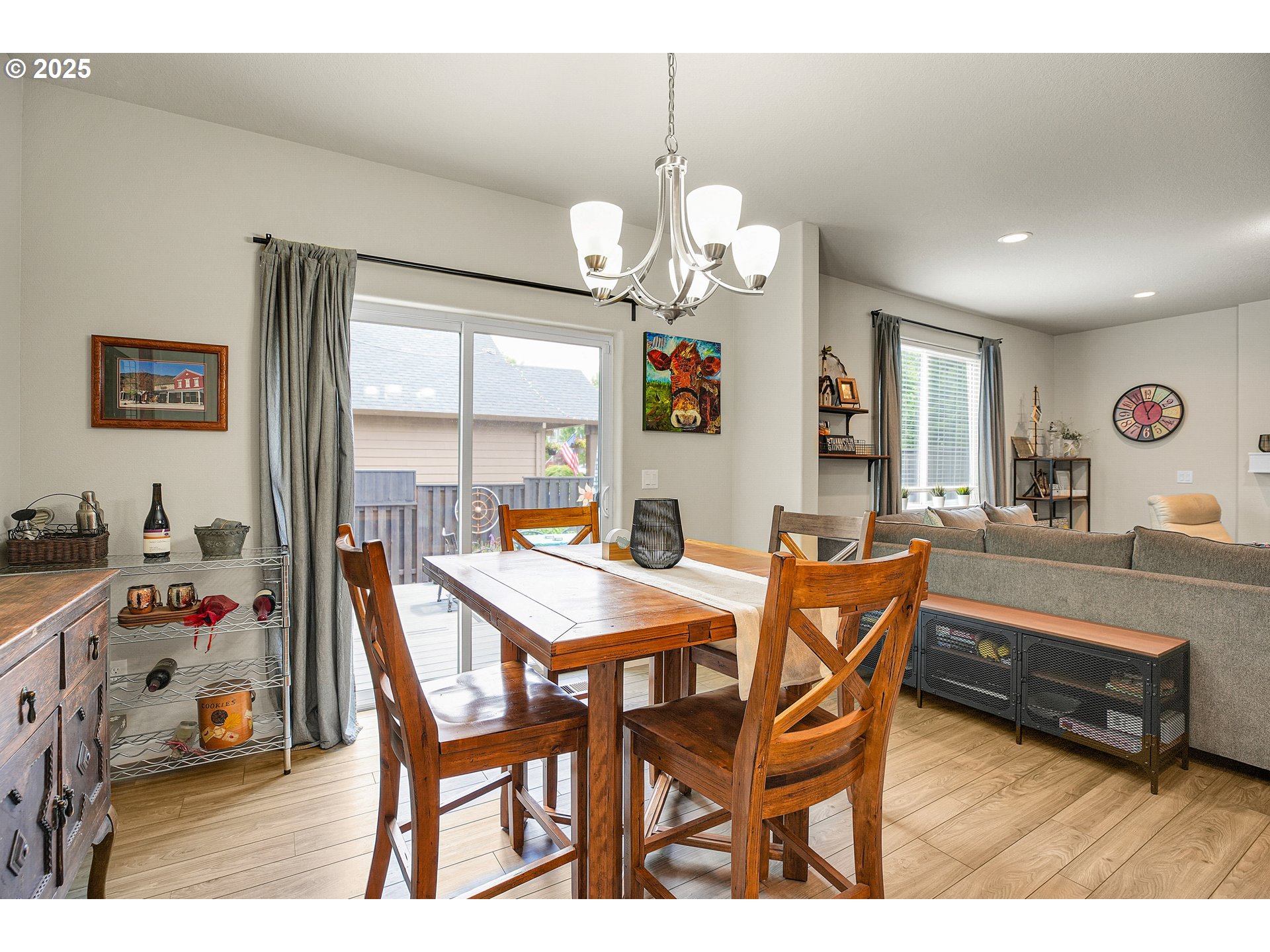 2796 Southeast Baker Avenue Gresham, OR 97080 - Photo 10 of 48 a view of a dining room with furniture and a chandelier