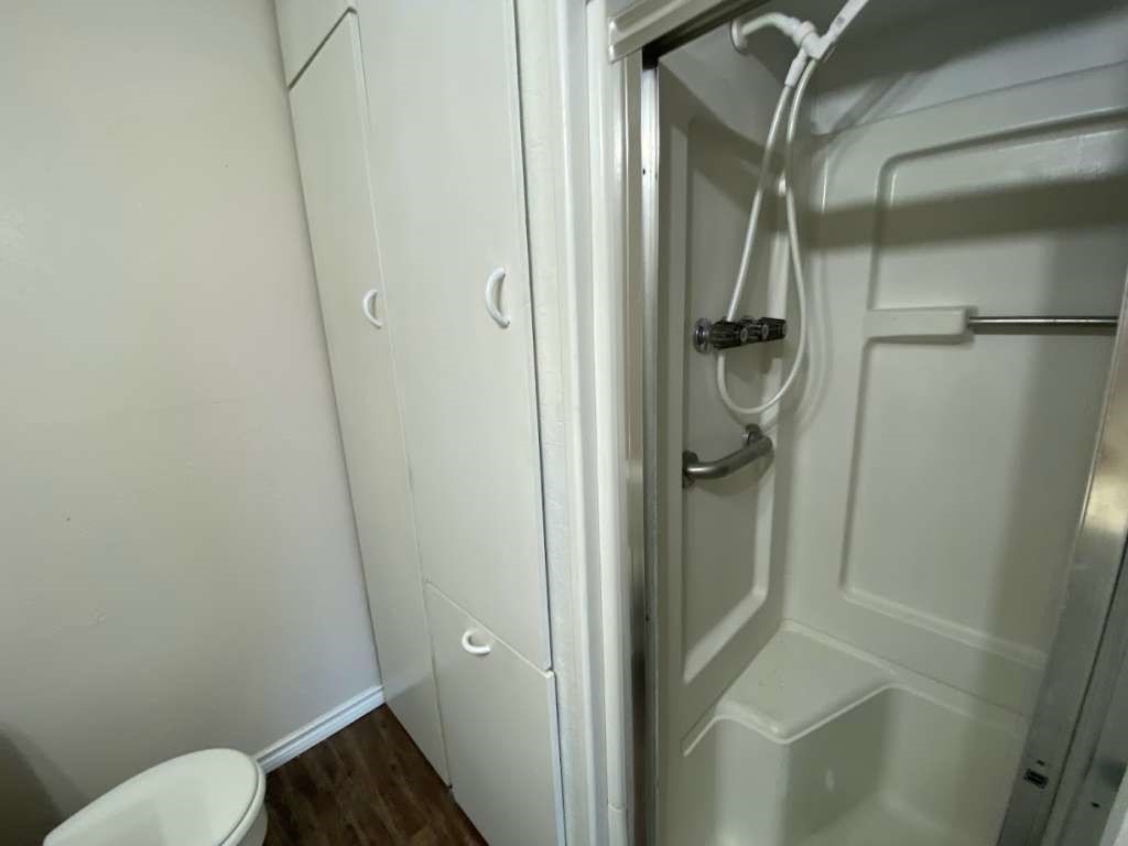 201 Ferguson Drive Cleveland, TX 77327 - Photo 11 of 27 a bathroom with a granite countertop shower