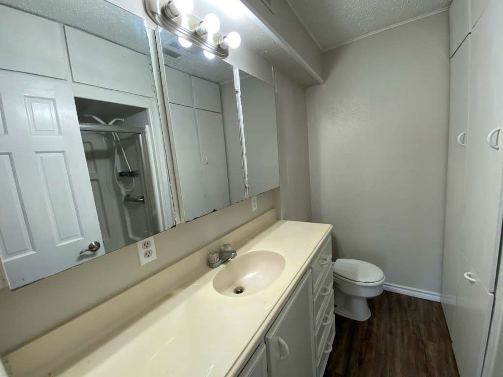 201 Ferguson Drive Cleveland, TX 77327 - Photo 14 of 27 a bathroom with a sink toilet and shower