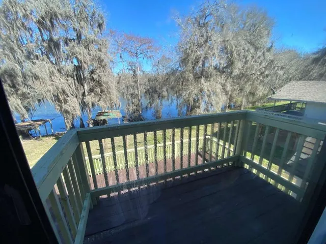 a view of a balcony with wooden fence