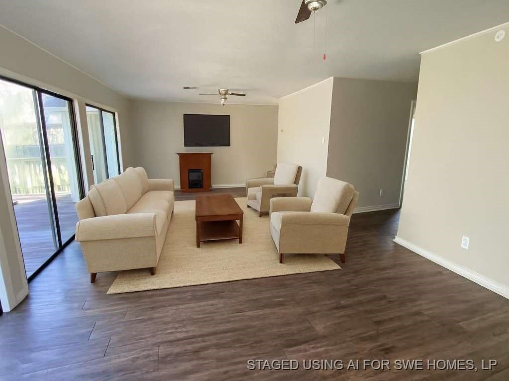 201 Ferguson Drive Cleveland, TX 77327 - Photo 7 of 27 a living room with furniture wooden floor and a large window