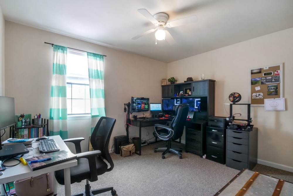 1030 General George Patton Road Nashville, TN 37221 - Photo 14 of 31 a view of a workspace with furniture and a window