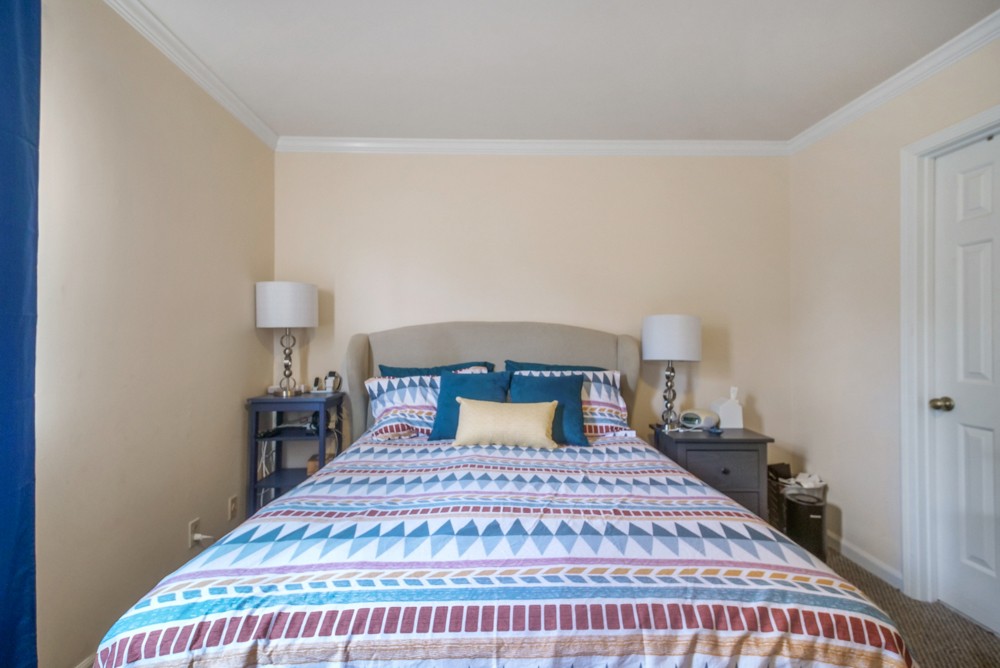 1030 General George Patton Road Nashville, TN 37221 - Photo 17 of 31 a bedroom with a bed and a lamp on dresser