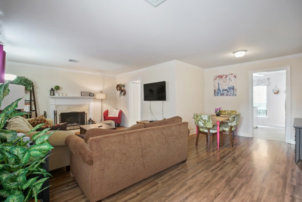 1030 General George Patton Road Nashville, TN 37221 - Photo 22 of 31 a living room with furniture a fireplace and a flat screen tv