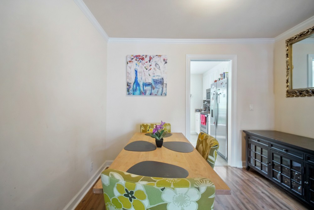 1030 General George Patton Road Nashville, TN 37221 - Photo 24 of 31 a bedroom with a bed and wooden floor