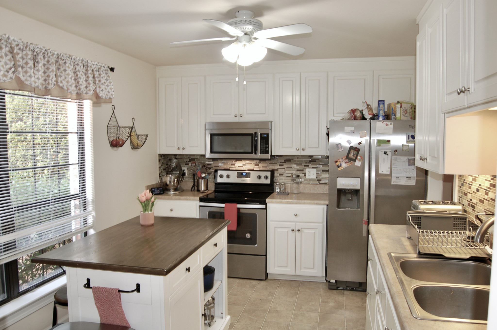 1030 General George Patton Road Nashville, TN 37221 - Photo 7 of 31 a kitchen with a sink stove and refrigerator