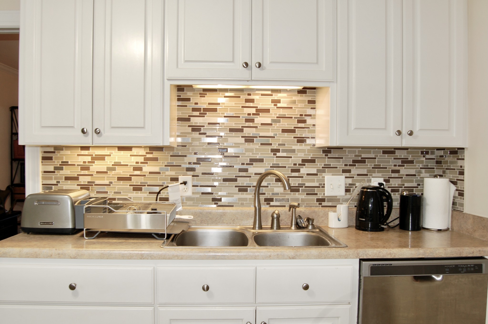 1030 General George Patton Road Nashville, TN 37221 - Photo 8 of 31 a kitchen with stainless steel appliances granite countertop white cabinets and a sink