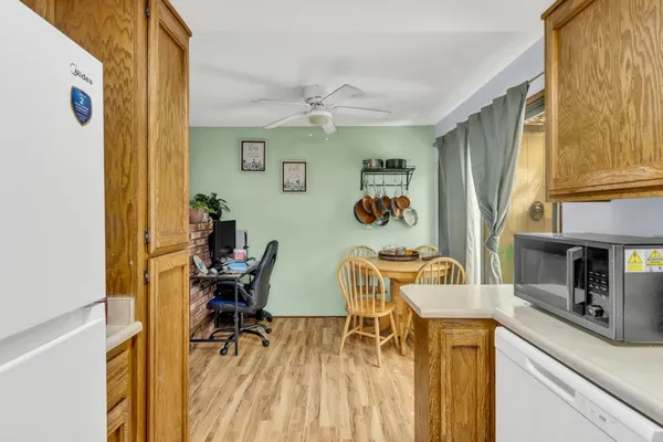 a view of a dining room with furniture and a window
