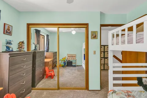 a view of living room with furniture and wooden floor