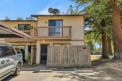 a view of a car park in front of house