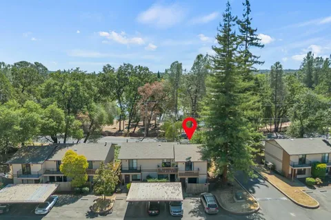 a view of a house with a yard and sitting area
