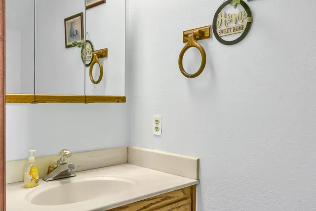 a bathroom with a sink and a mirror