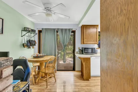 a dining room with furniture and window
