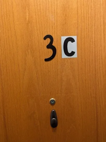 a bathroom with a granite countertop sink and mirror