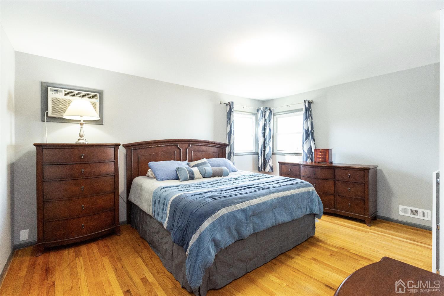 28 Melville Road Edison, NJ 08817 - Photo 11 of 52 a bedroom with a bed and a dresser