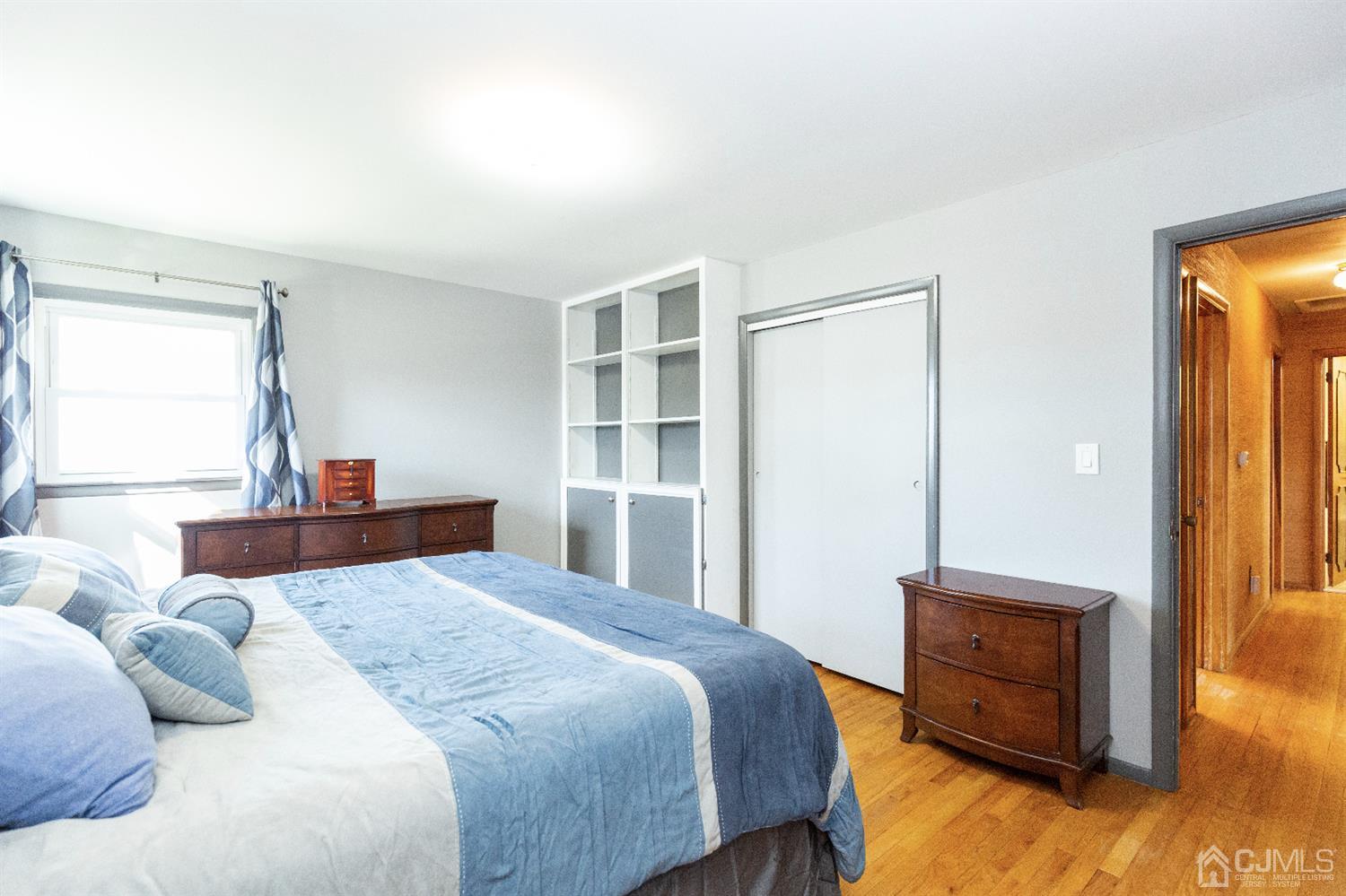 28 Melville Road Edison, NJ 08817 - Photo 12 of 52 a bedroom with a bed and wooden floor