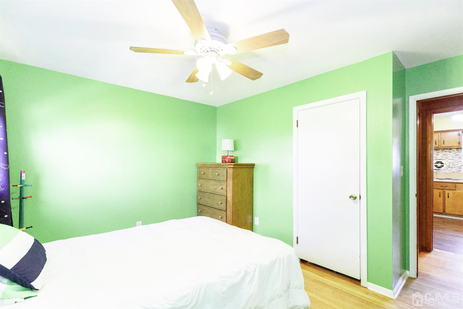 28 Melville Road Edison, NJ 08817 - Photo 20 of 52 a bedroom with a bed and a chandelier