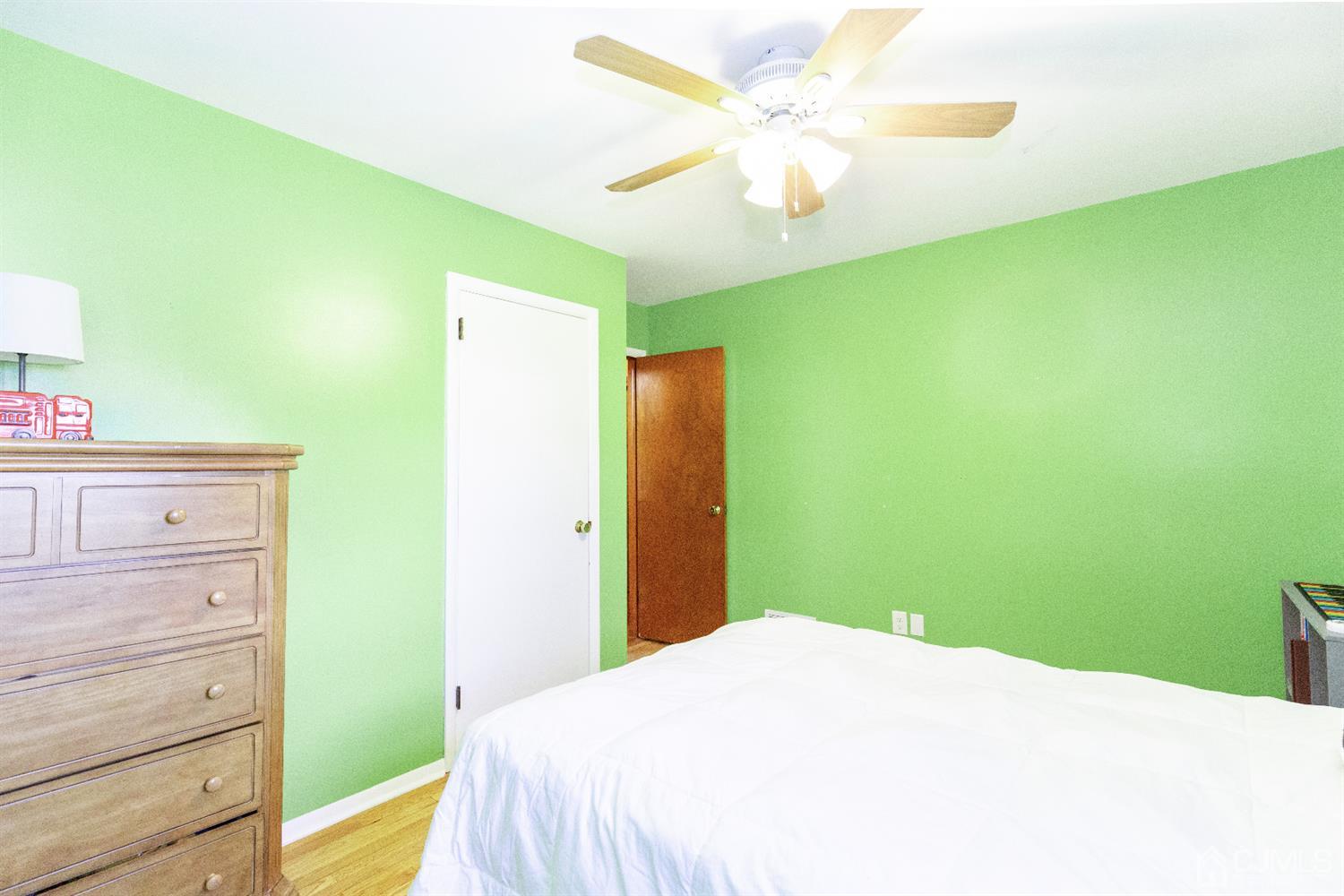 28 Melville Road Edison, NJ 08817 - Photo 21 of 52 a bedroom with a bed and a dresser
