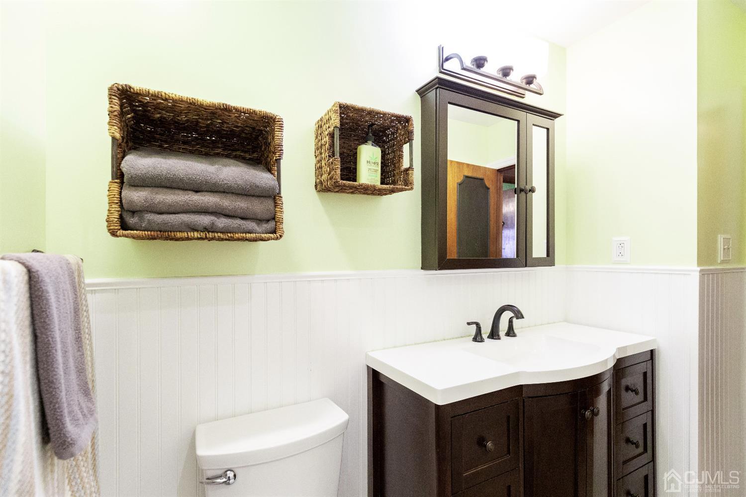 28 Melville Road Edison, NJ 08817 - Photo 24 of 52 a bathroom with a toilet sink and mirror