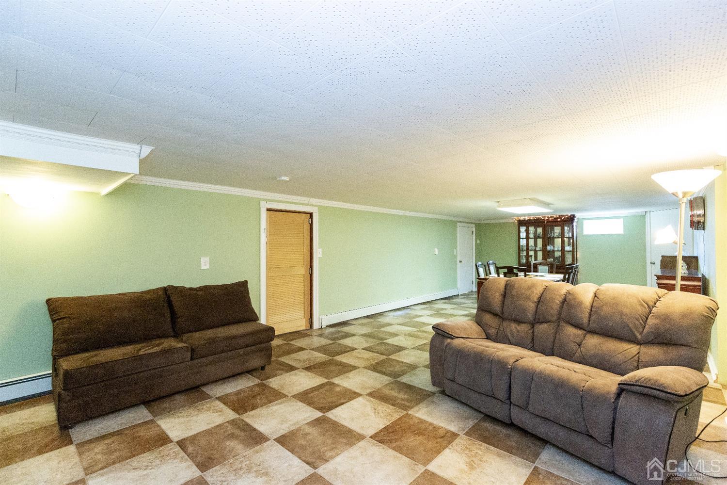 28 Melville Road Edison, NJ 08817 - Photo 26 of 52 a living room with furniture and couch