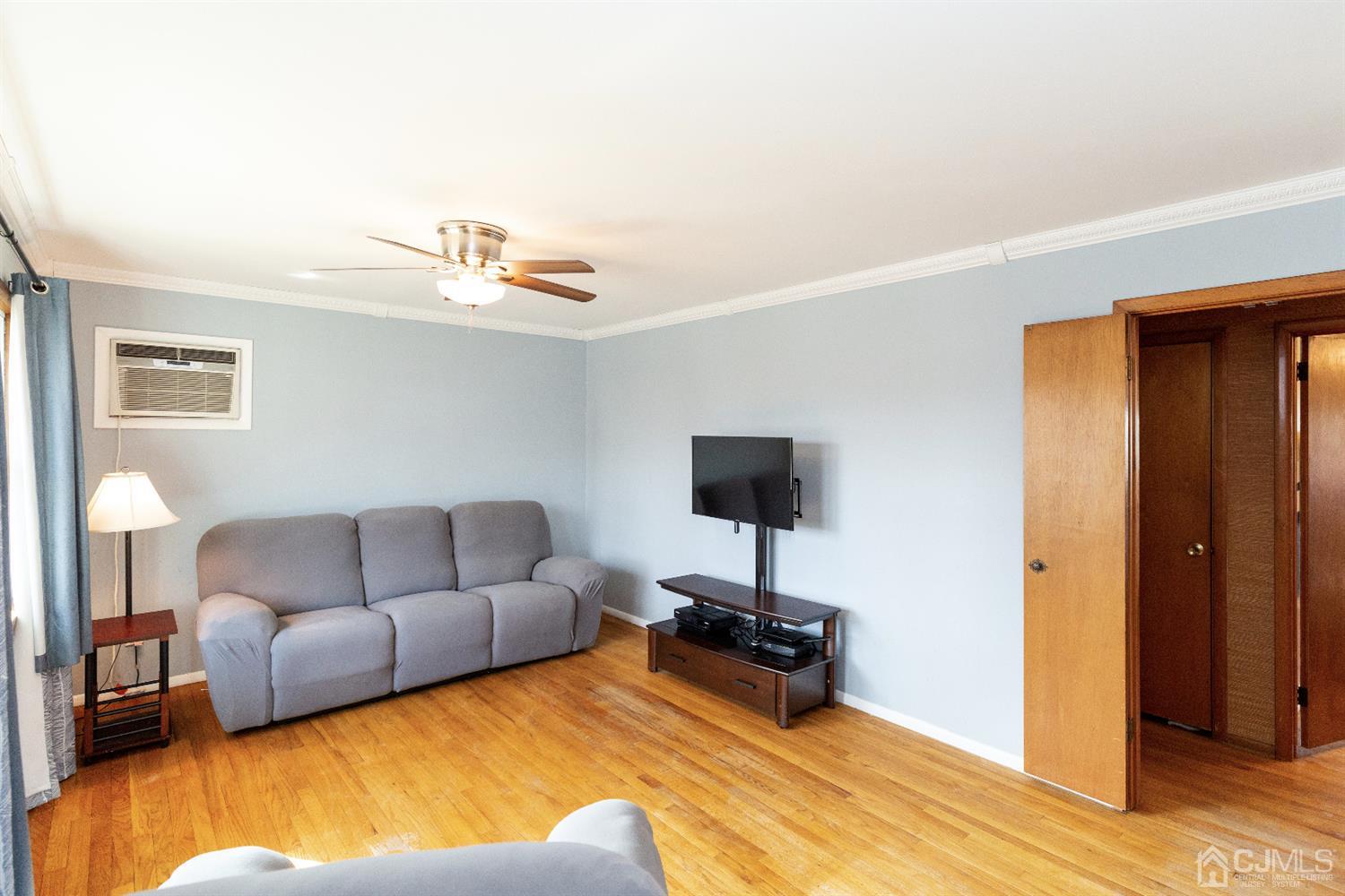 28 Melville Road Edison, NJ 08817 - Photo 4 of 52 a living room with furniture and a wooden floor
