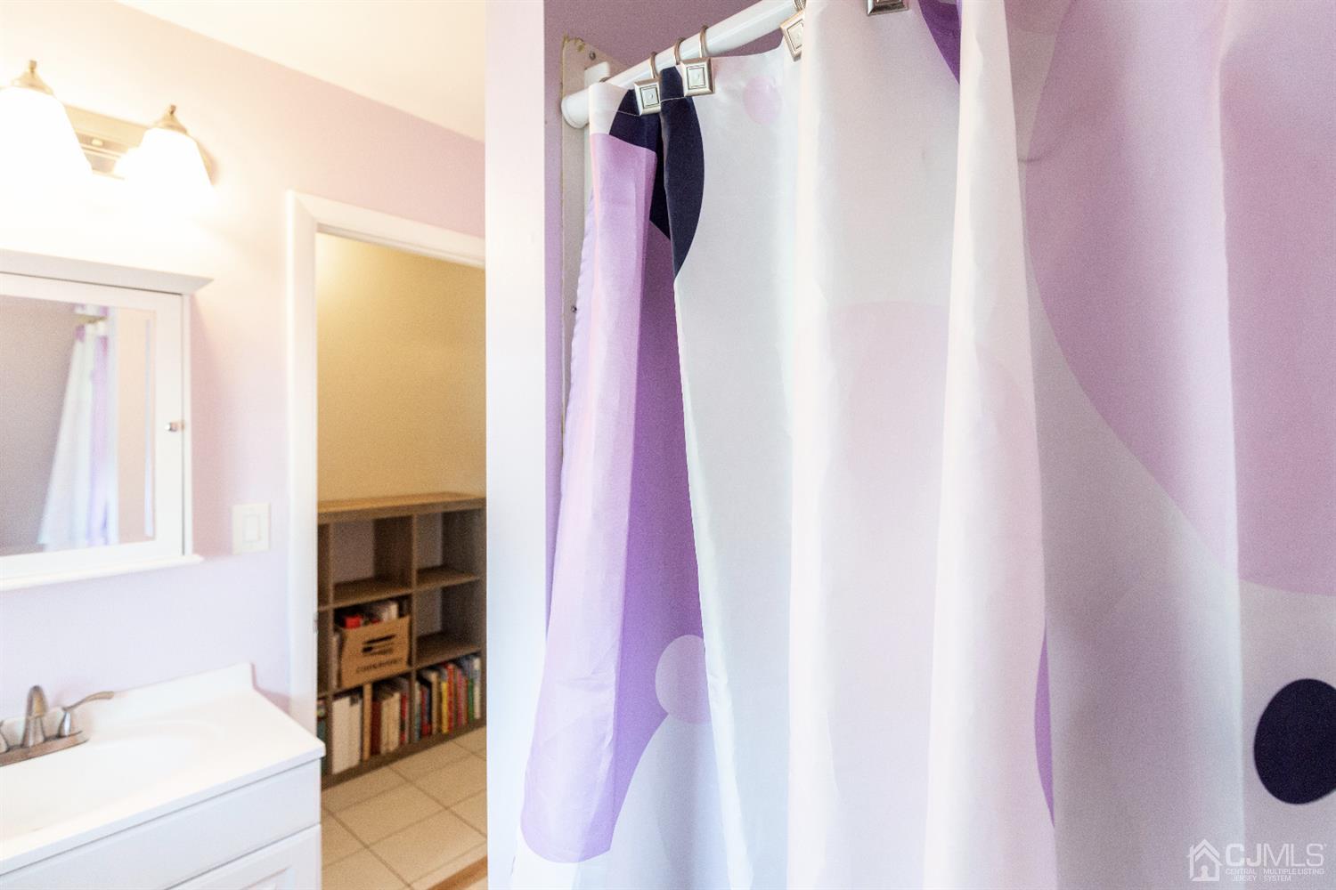 28 Melville Road Edison, NJ 08817 - Photo 42 of 52 a view of walk in closet with clothes and shoes