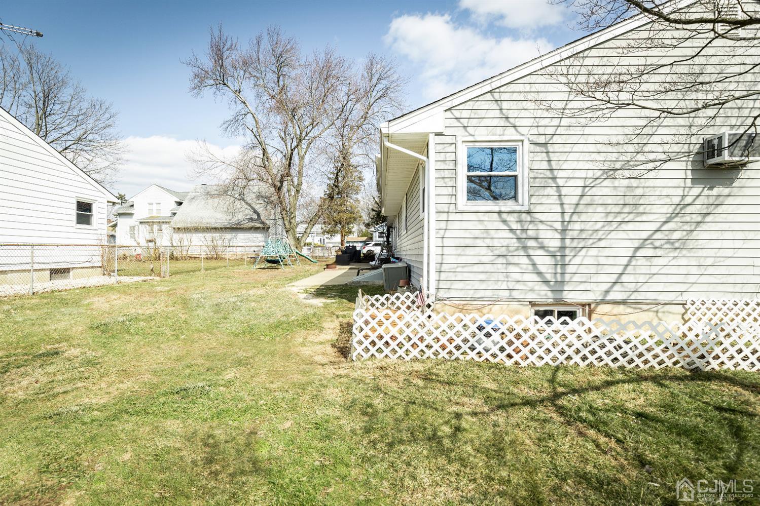 28 Melville Road Edison, NJ 08817 - Photo 44 of 52 a view of a backyard with wooden fence