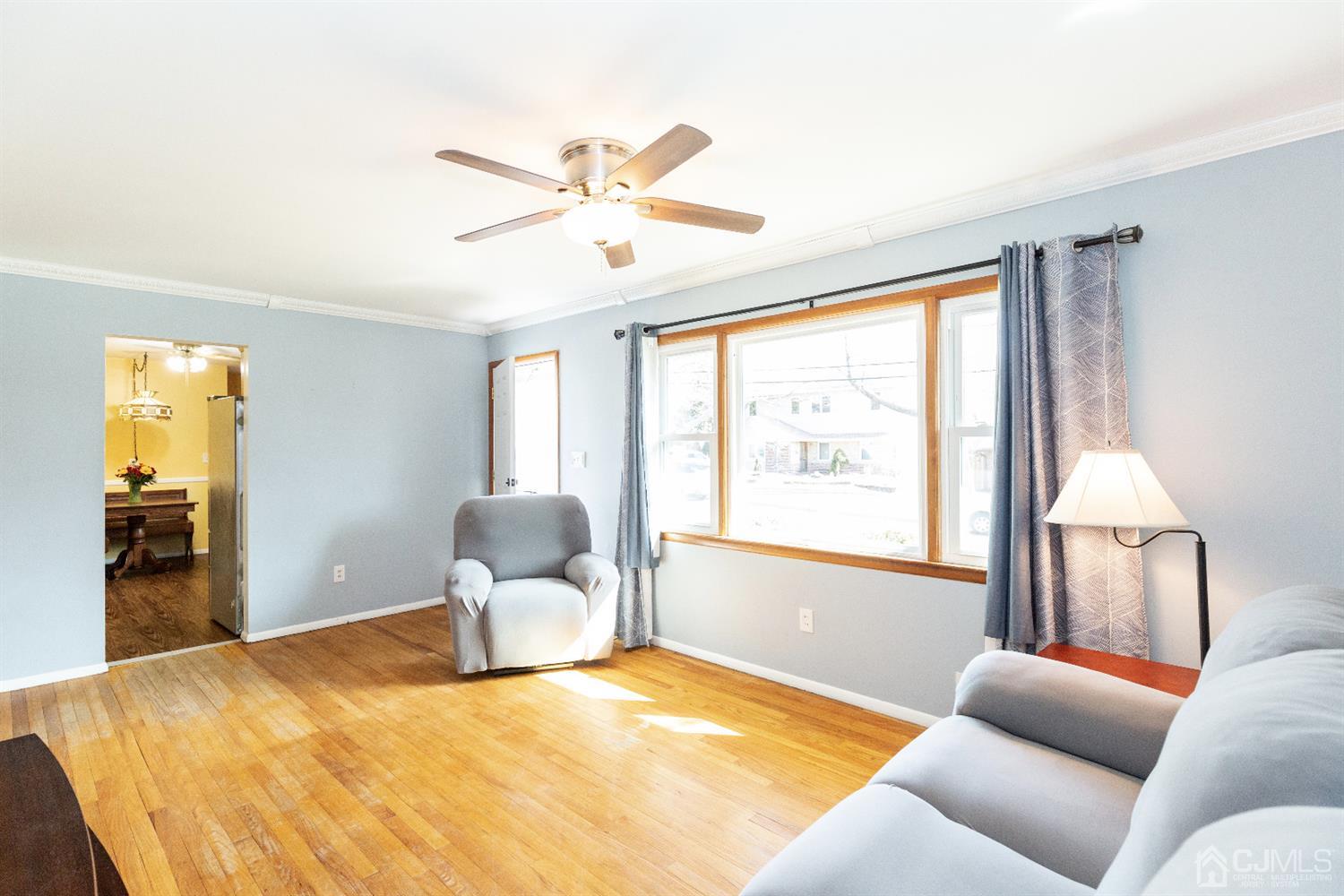 28 Melville Road Edison, NJ 08817 - Photo 6 of 52 a bedroom with a large bed and ceiling fan