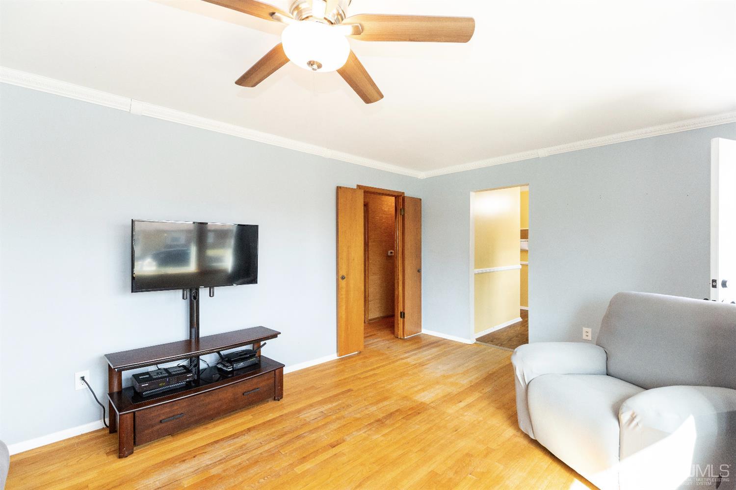 28 Melville Road Edison, NJ 08817 - Photo 7 of 52 a living room with furniture and a flat screen tv