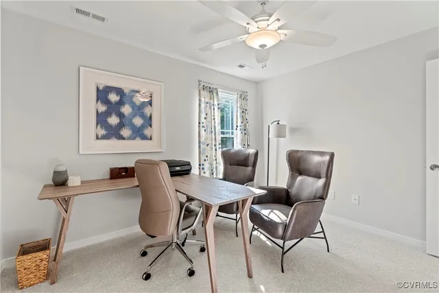 a view of a livingroom with furniture and a chandelier