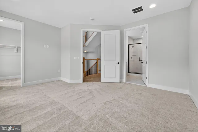 a view of staircase with railing windows and stairs
